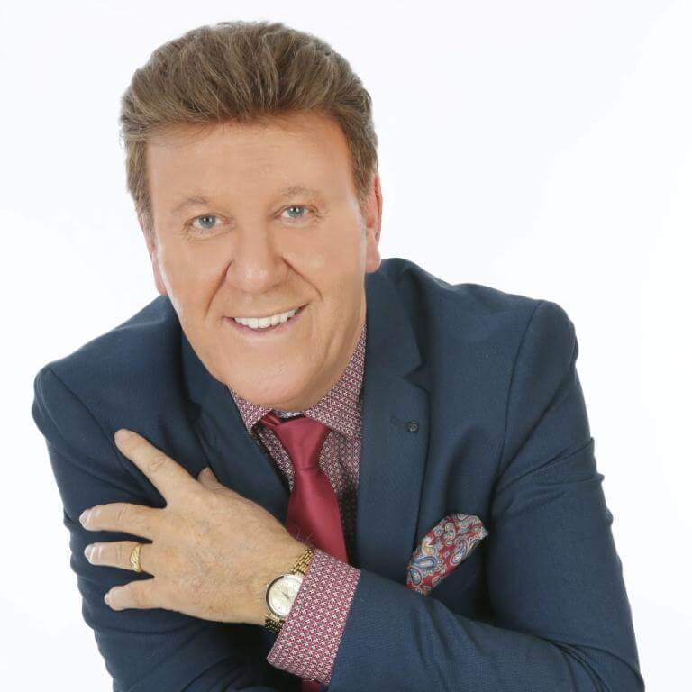 Foto van Danny die lief naar de camrera lacht